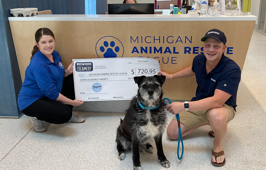 BROWNDOG check presentation at Michigan Animal Rescue League, with a rescue dog